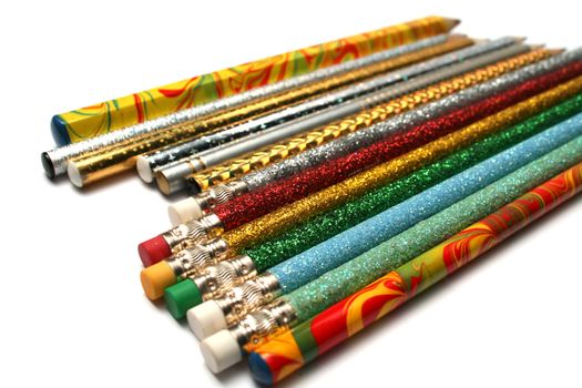 Set of sparkling celebratory pencils located on a diagonal