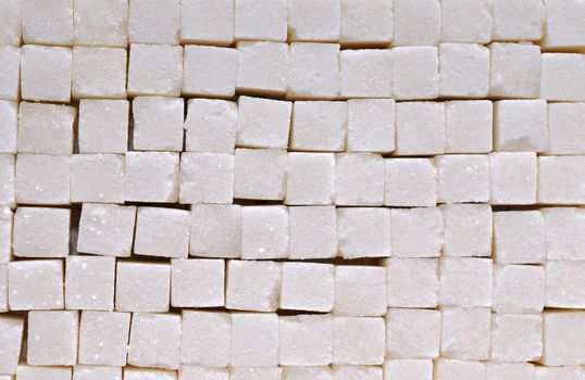 White sugar cubes background with studio light 