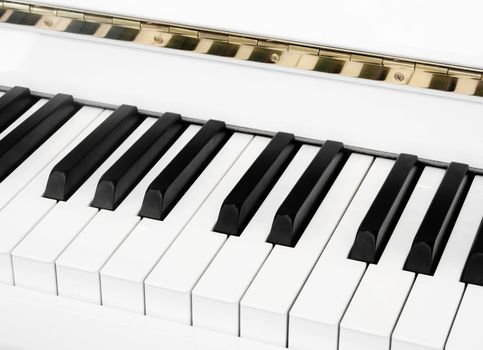 Closeup of a keyboard white  piano 