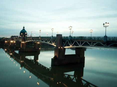 Pont Saint Pierre bridge over the garonne in the city of Toulouse in France at dusk
