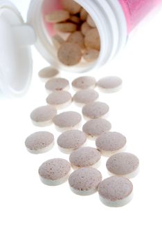 Tablets  ,Pills Spilling out of Pill Bottle closeup