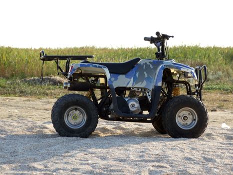 Small All Terrain Vehicle on a beach