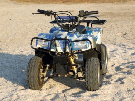 Small All Terrain Vehicle on a beach 2