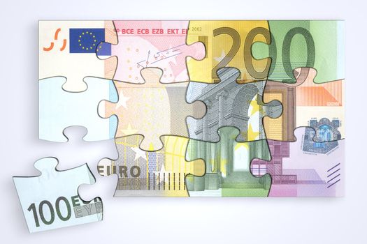 mixed euro notes puzzle from top with a single separate piece