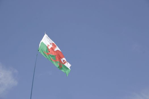 welsh flag against a blue sky