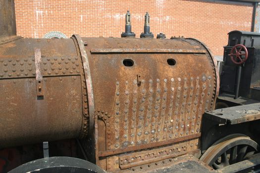 rusty old steam engine boiler