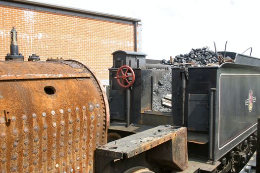 old train boiler to be restored and tender full of coal