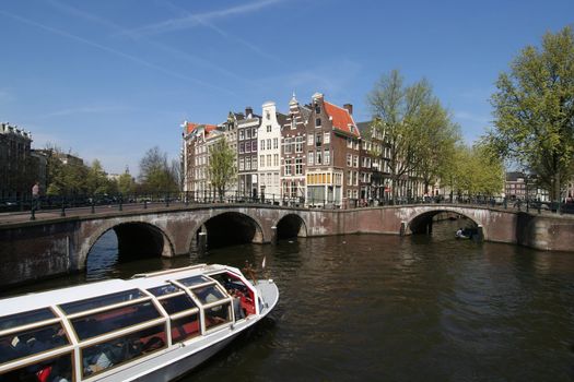 Tour boat in an Amsterdam canal