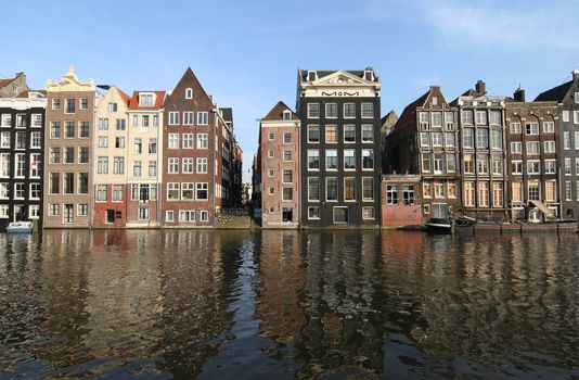 Canal houses and their reflections in Amsterdam