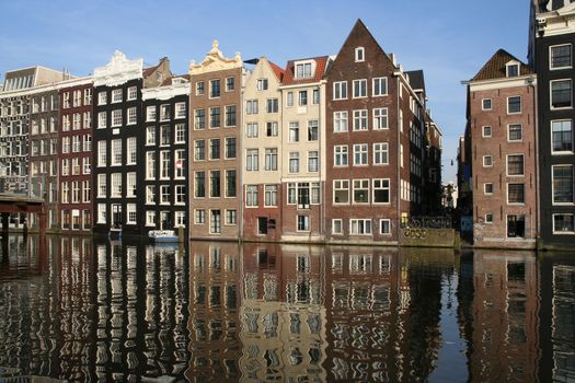 Canal houses and their reflections in Amsterdam