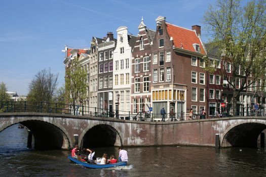 People boating in an Amsterdam canal