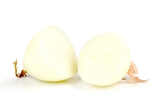 an onion cut in two, isolated on a white background