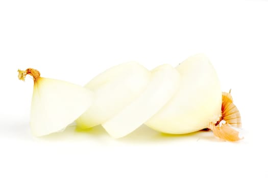 an onion cut in slices, isolated on a white background