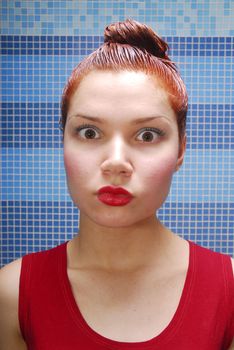 Surprised girl with dyeing and red lips