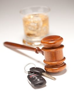 Gavel, Alcoholic Drink & Car Keys on a Gradated Background - Drinking and Driving Concept.