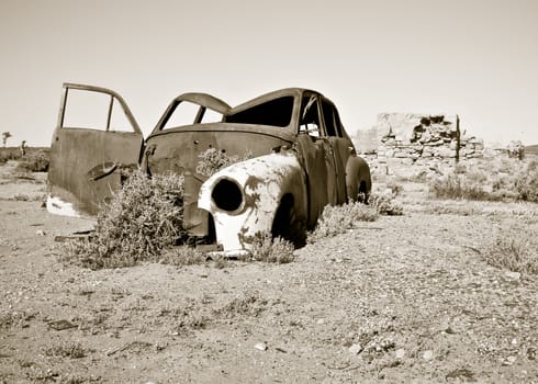 old rusty car in the desert 