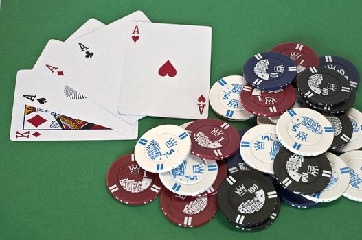 poker chips with axes of different cuts and colors on green background