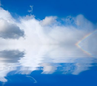 rainbow on a background of clouds and water