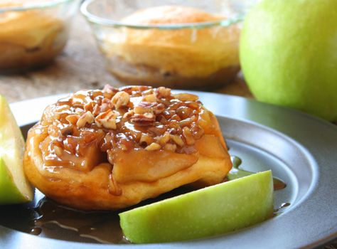 Upside down Apple Caramel biscuit with fresh apple slices on a plate.