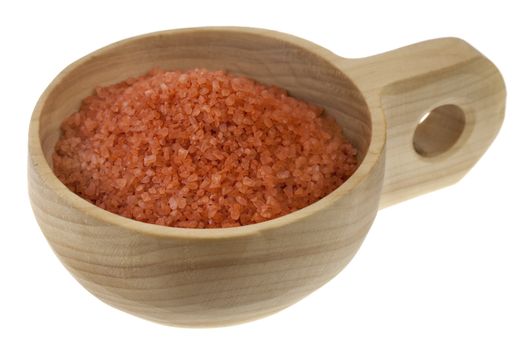 Crystals of traditional Hawaiian alaea sea salt containing red clay and rich in minerals on a primitive rustic wooden bowl (scoop); isolated on white