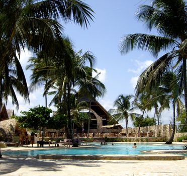 Glimpse of a typical village with pool Zanzibari