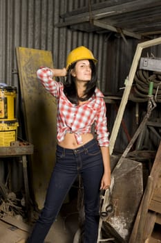 A young female apprentice working on a construction site. 