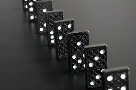 black domino showing financial or economic crisis concept