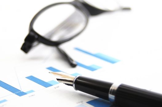 paperwork with diagram and pen showing success