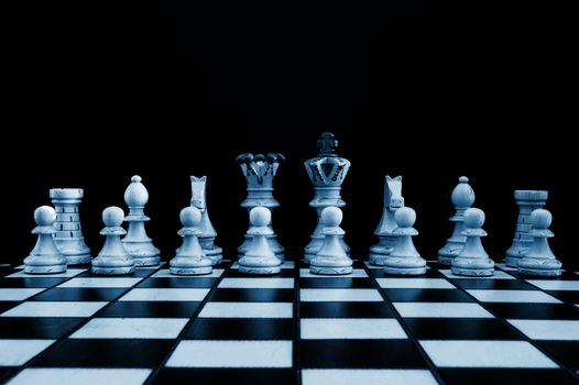 chess pieces showing power competition conflict and strategy in business