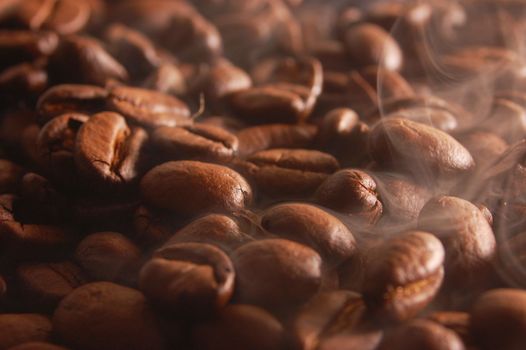 roasting coffee beans with steam and smoke