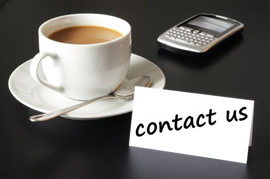 contact us and coffee cup showing business support concept