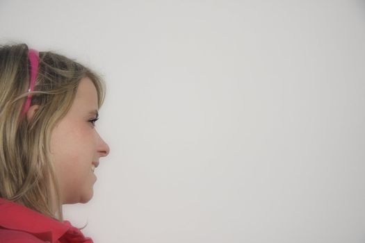 Pretty girl's profile on white background.