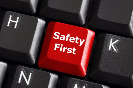 safety first concept with red key on computer keyboard