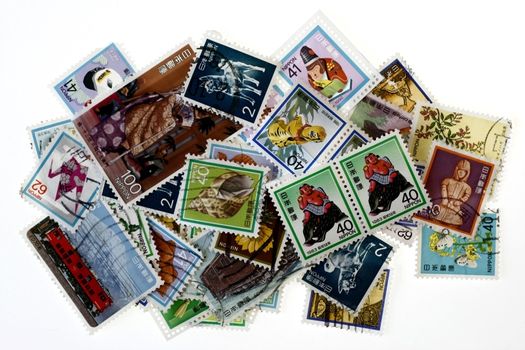 Vintage Collectible Stamps in groups in white background
