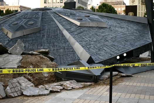 Crashed UFO concept at seoul korea with police line