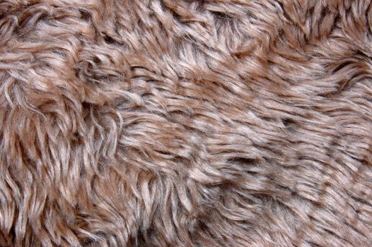 brown cuddly fur textile texture which can be used as background