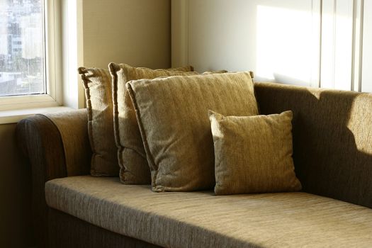 Cozy Sofa overshadowed in a morning sunlight