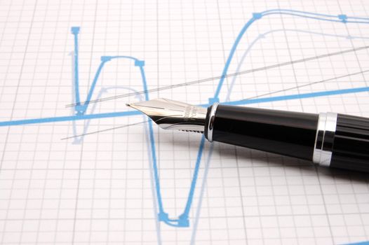 black fountain pen on business stock chart