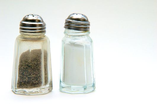 A salt and pepper shaker on a white background
