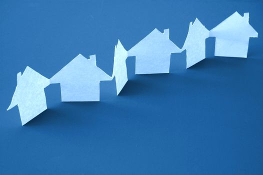 paper houses or homes showing a concept for real estate