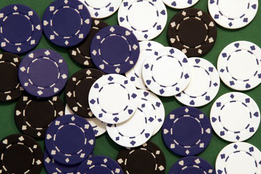 Casino Chips, Black, Blue, White on Green Background