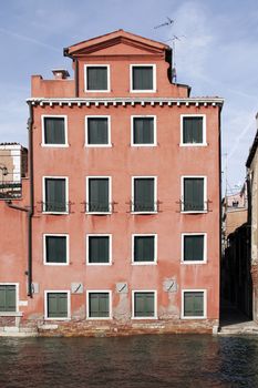 Venice, Italy - Typical Old Building Water Front Facade And Canal