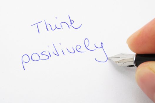 think positive concept with pen and paper