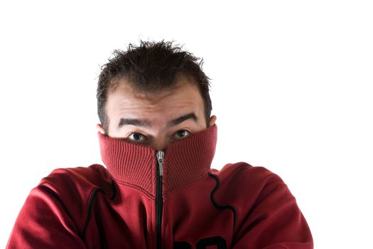 A cold man shivering and burying his face into his sweater. A great concept for HVAC.