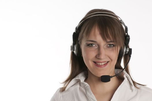 Closeup portrait of a happy young call centre employee speaking over the cellphone