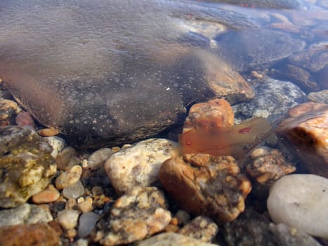 ice and stones in water