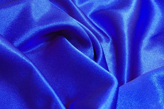 blue satin or silk background with textile texture