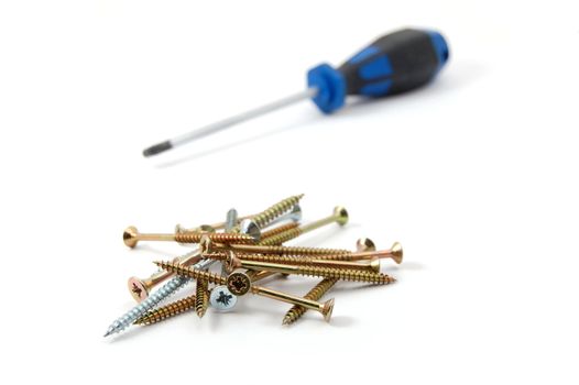 screwdriver and some screws isolated on white background