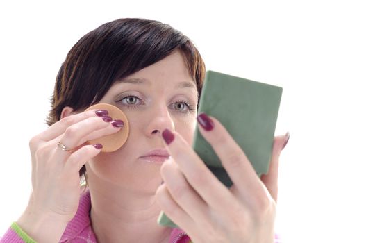 Young woman put beauty make-up on face