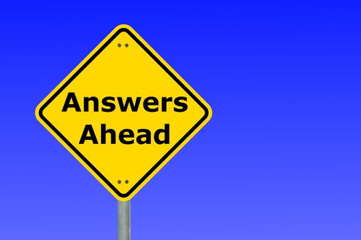 answers ahead written on a yellow road sign